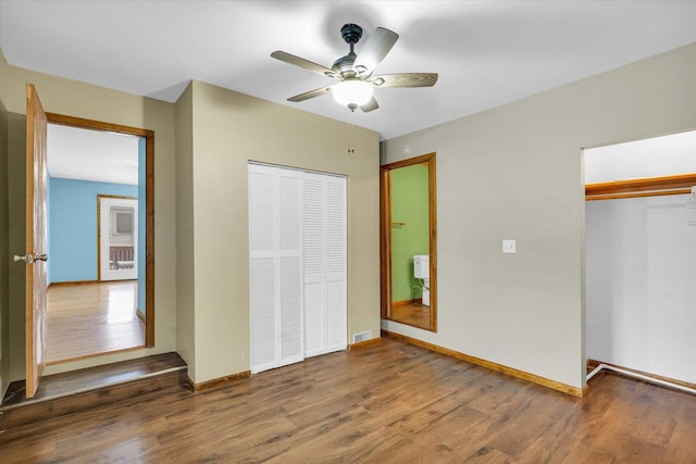 unfurnished bedroom featuring hardwood / wood-style flooring and ceiling fan