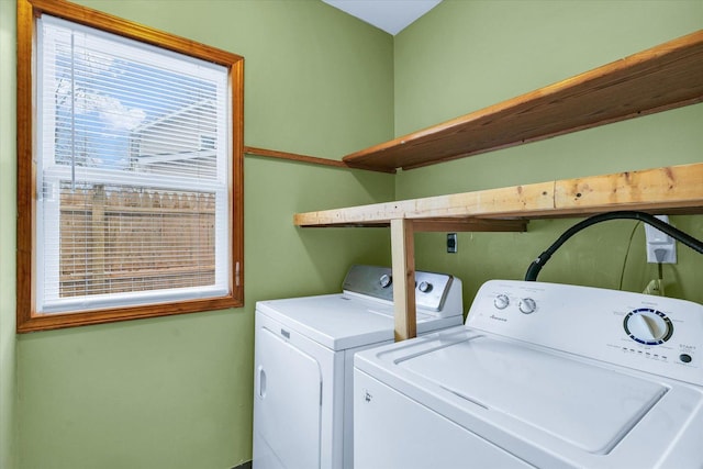 washroom with washing machine and clothes dryer