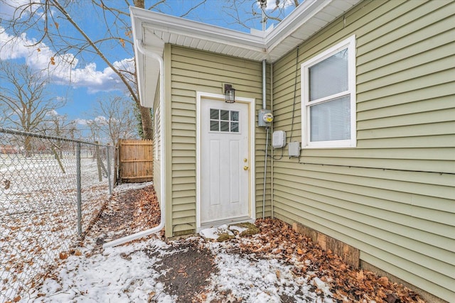 view of snow covered property entrance