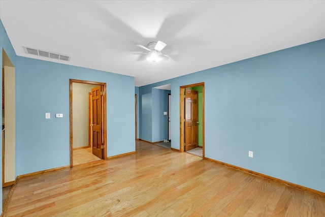 unfurnished bedroom with ceiling fan, light hardwood / wood-style flooring, and ensuite bathroom