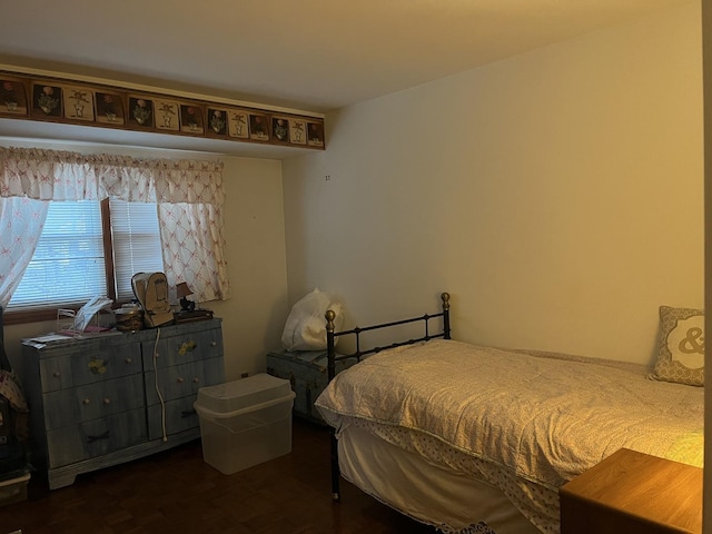 bedroom featuring dark hardwood / wood-style flooring