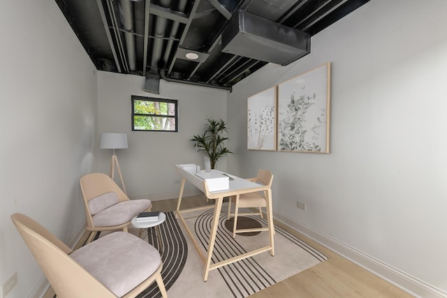 office space with hardwood / wood-style flooring