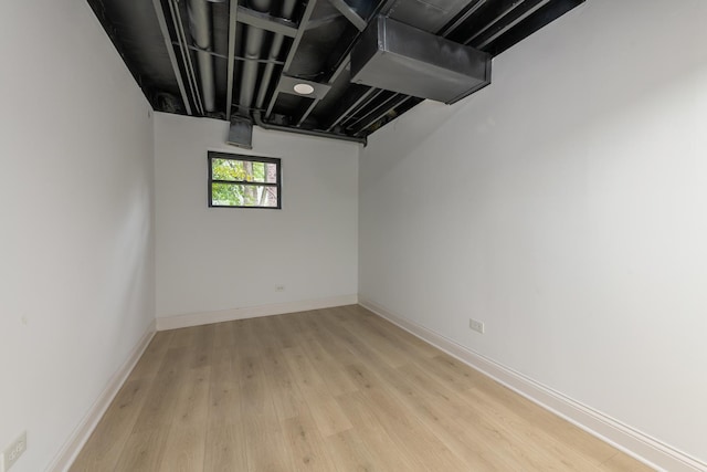 basement featuring light hardwood / wood-style flooring