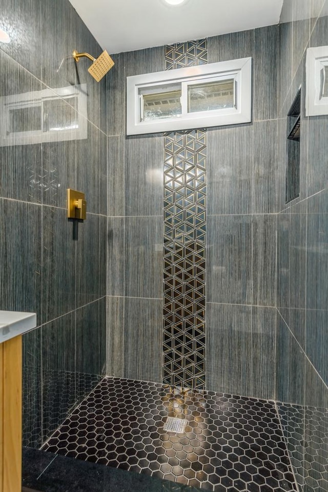 bathroom with tiled shower