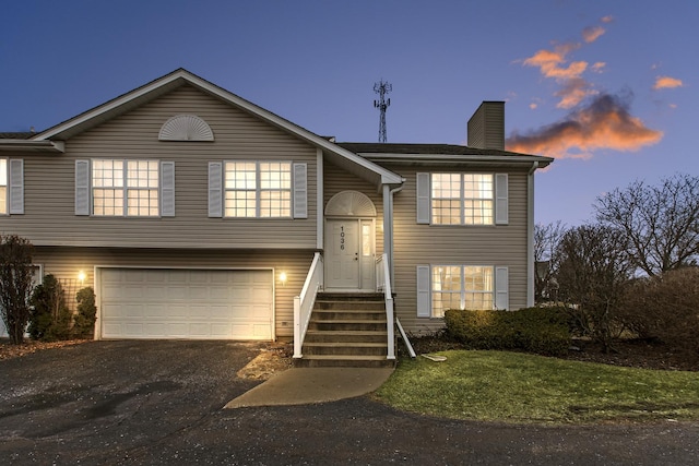 bi-level home featuring a garage