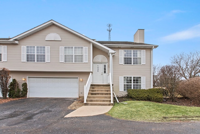 bi-level home featuring a garage