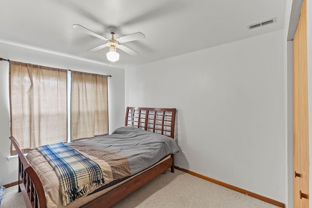 bedroom featuring ceiling fan and light colored carpet