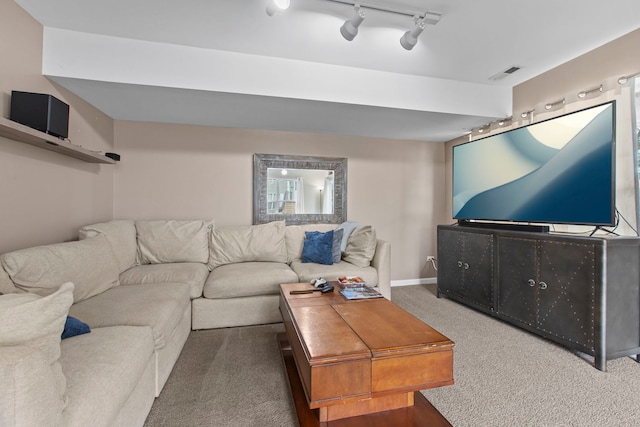 living room featuring carpet flooring and track lighting