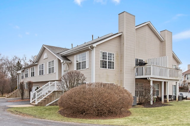 view of home's exterior with a yard