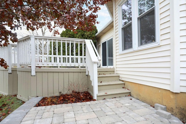 view of exterior entry featuring a patio