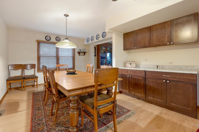 dining room with light wood-type flooring