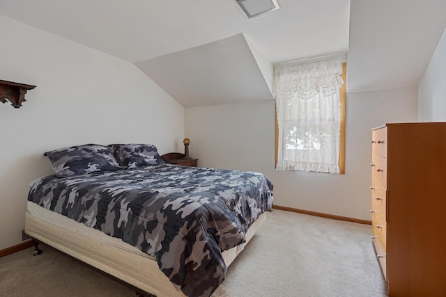 carpeted bedroom with vaulted ceiling