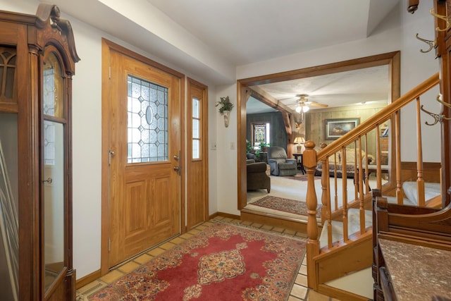 foyer entrance featuring a wealth of natural light and ceiling fan