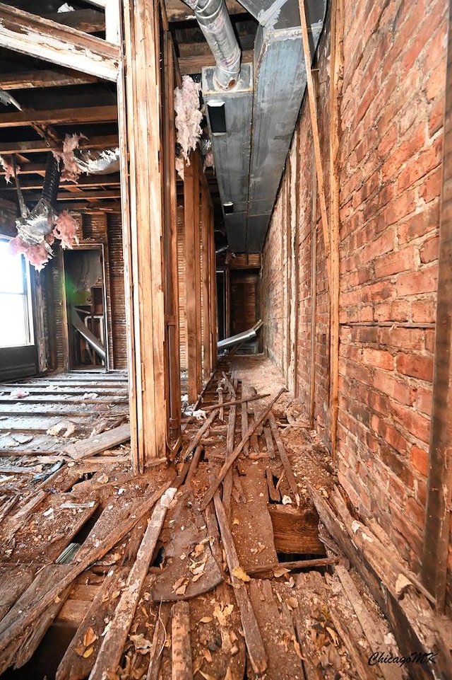 miscellaneous room featuring brick wall