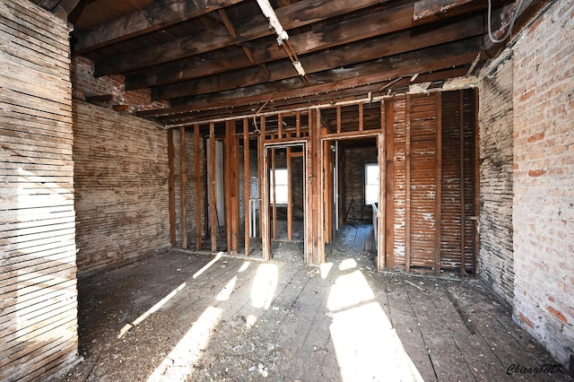 miscellaneous room with brick wall