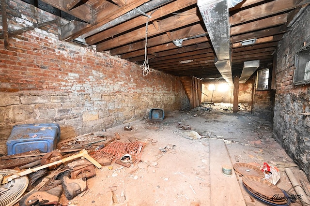 miscellaneous room featuring brick wall