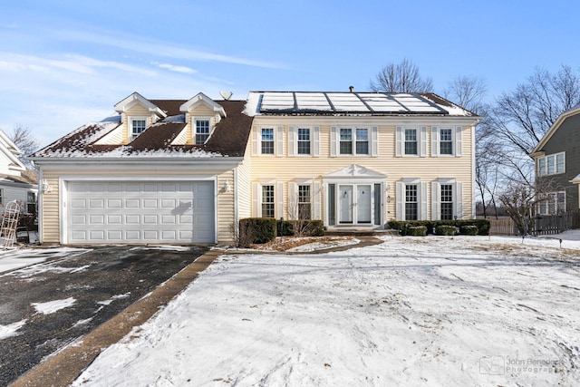 view of front of property featuring solar panels