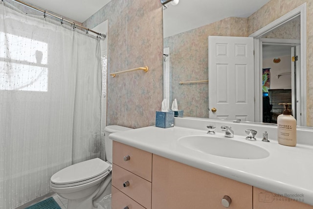 full bathroom featuring shower / bathtub combination with curtain, vanity, and toilet