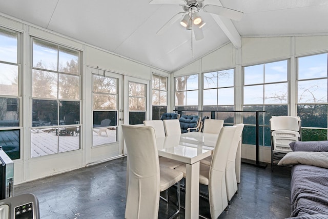 sunroom featuring ceiling fan, plenty of natural light, and lofted ceiling with beams