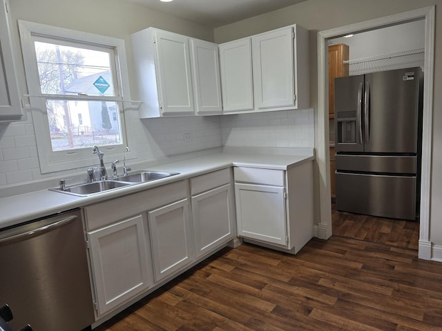 kitchen with white cabinetry, dark hardwood / wood-style flooring, and appliances with stainless steel finishes