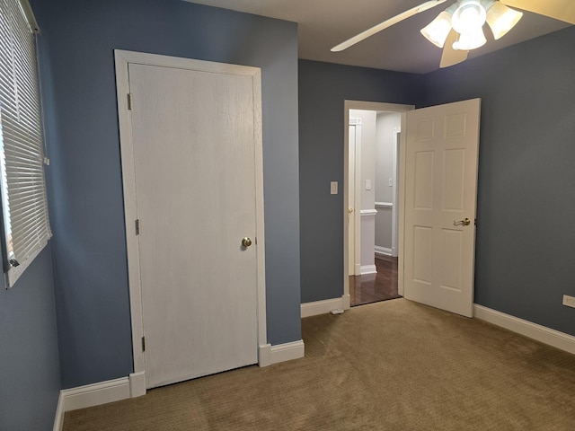 unfurnished bedroom with carpet floors, a closet, and ceiling fan