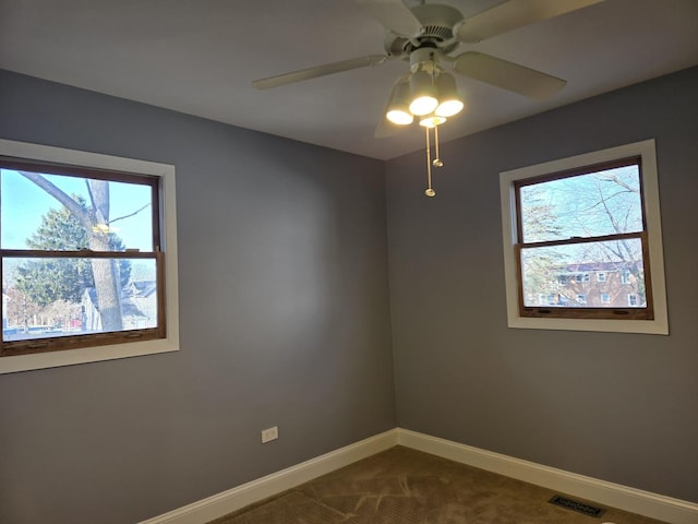 carpeted empty room with ceiling fan