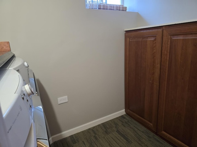 washroom with washer and dryer and dark hardwood / wood-style flooring