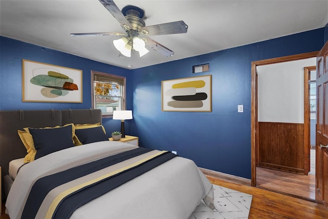 bedroom featuring ceiling fan and wood-type flooring