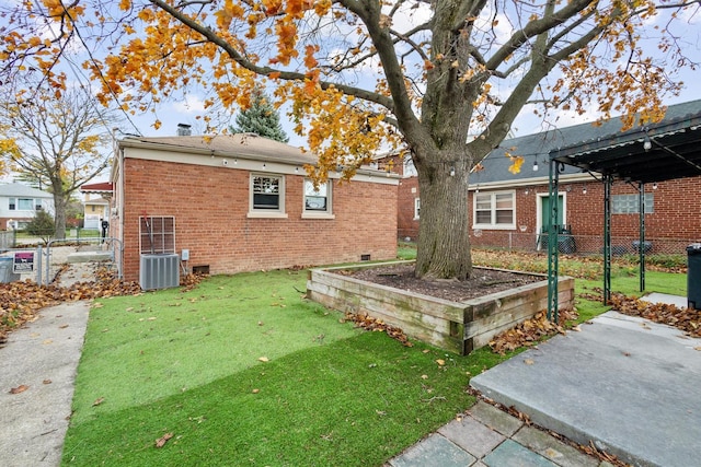 view of yard featuring central AC