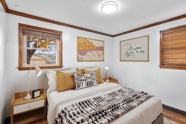 bedroom featuring wood-type flooring and ornamental molding