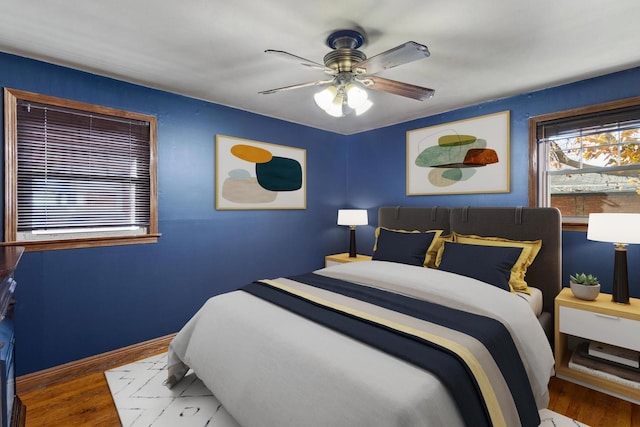 bedroom featuring hardwood / wood-style flooring and ceiling fan