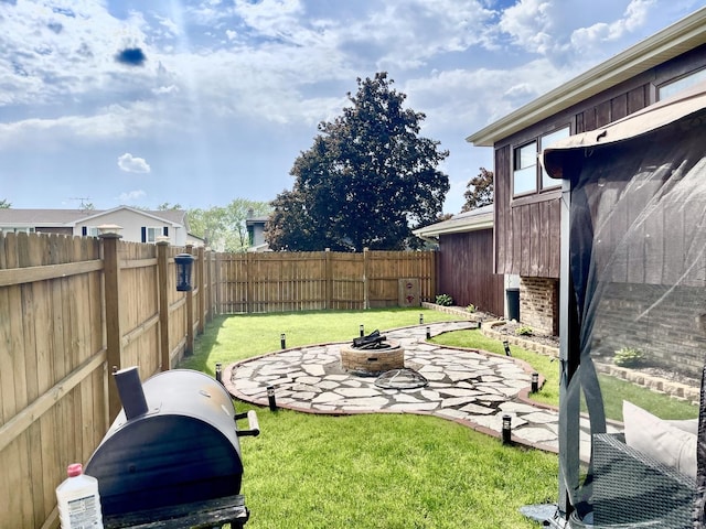 view of yard featuring a fire pit and a patio area