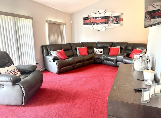 carpeted living room with lofted ceiling