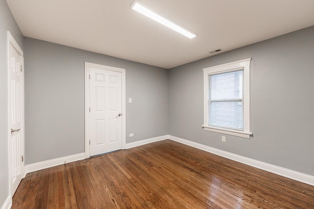 bedroom featuring dark hardwood / wood-style flooring