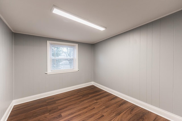 corridor with dark hardwood / wood-style flooring