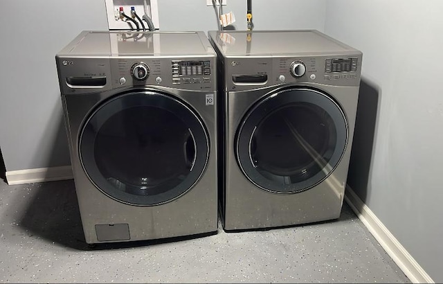 clothes washing area featuring independent washer and dryer