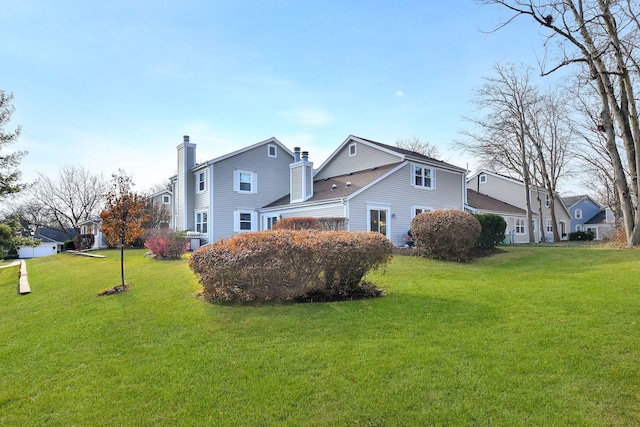 view of home's exterior with a lawn