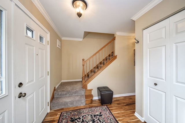 entryway featuring crown molding and wood-type flooring