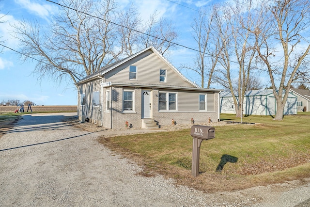 bungalow-style home featuring a front yard