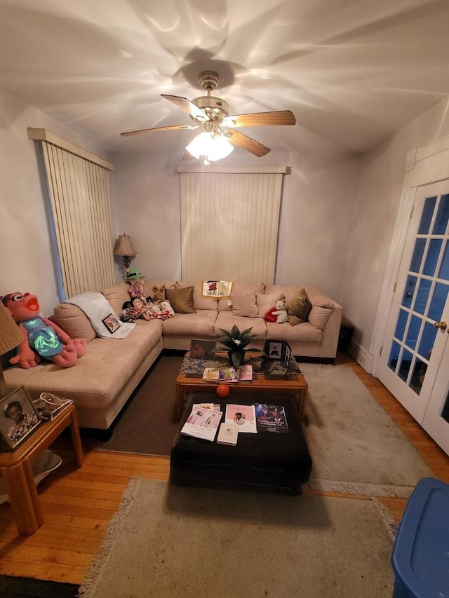 living room with ceiling fan and hardwood / wood-style floors