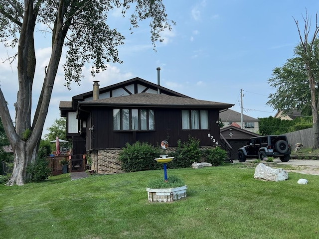 back of house featuring a yard