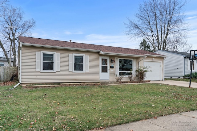 ranch-style house with a front lawn and a garage