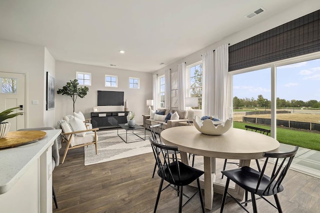 dining room with dark hardwood / wood-style floors