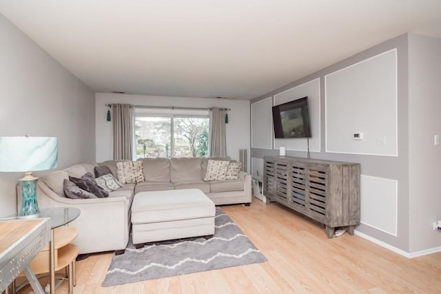 living room with light hardwood / wood-style floors