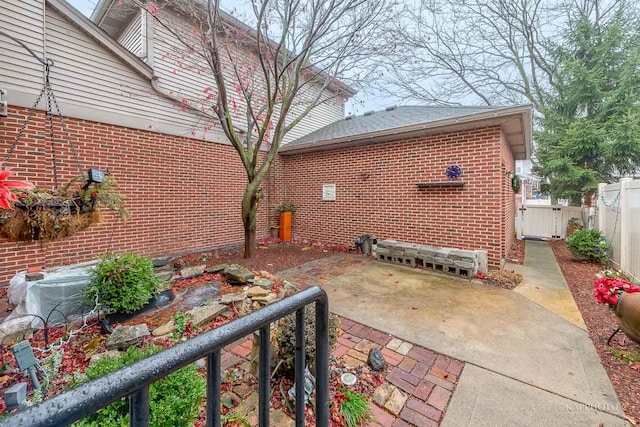 view of property exterior featuring a patio area and central AC unit