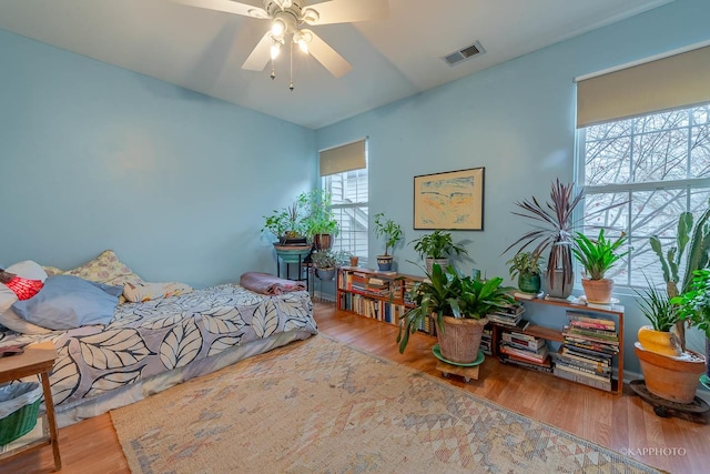 bedroom featuring ceiling fan and wood-type flooring