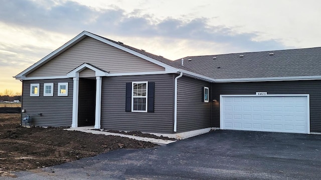 view of front of property featuring a garage