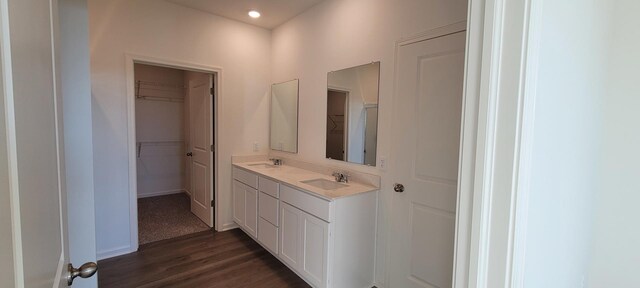 kitchen with white cabinetry, sink, stainless steel appliances, and light stone counters