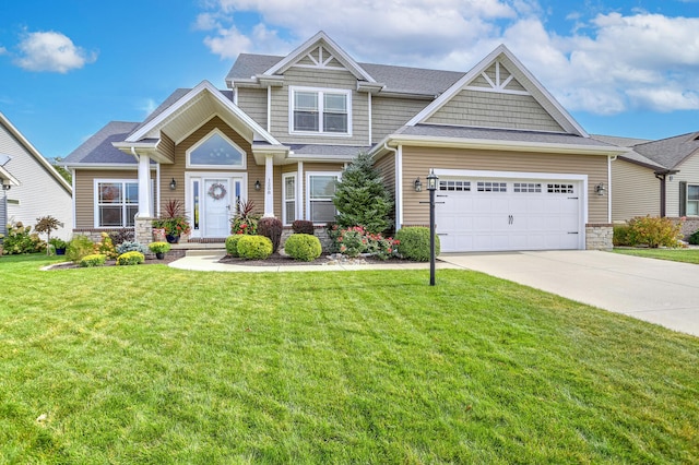 craftsman-style home featuring a front yard and a garage