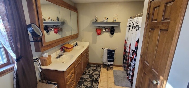 bathroom with tile patterned floors and vanity